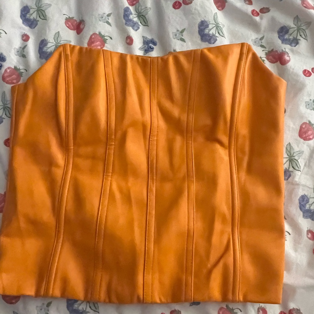 Tiger mist orange corset top size M. Stains are from hanger but hair covers it
